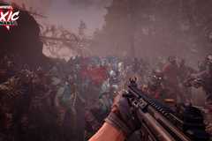 A first person view of someone point a gun at a horde of zombies in Toxic Commando